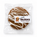Gingerbread cake with white icing drizzle in clear packaging, featuring 'Big Boy's Gooey Cakes' label.