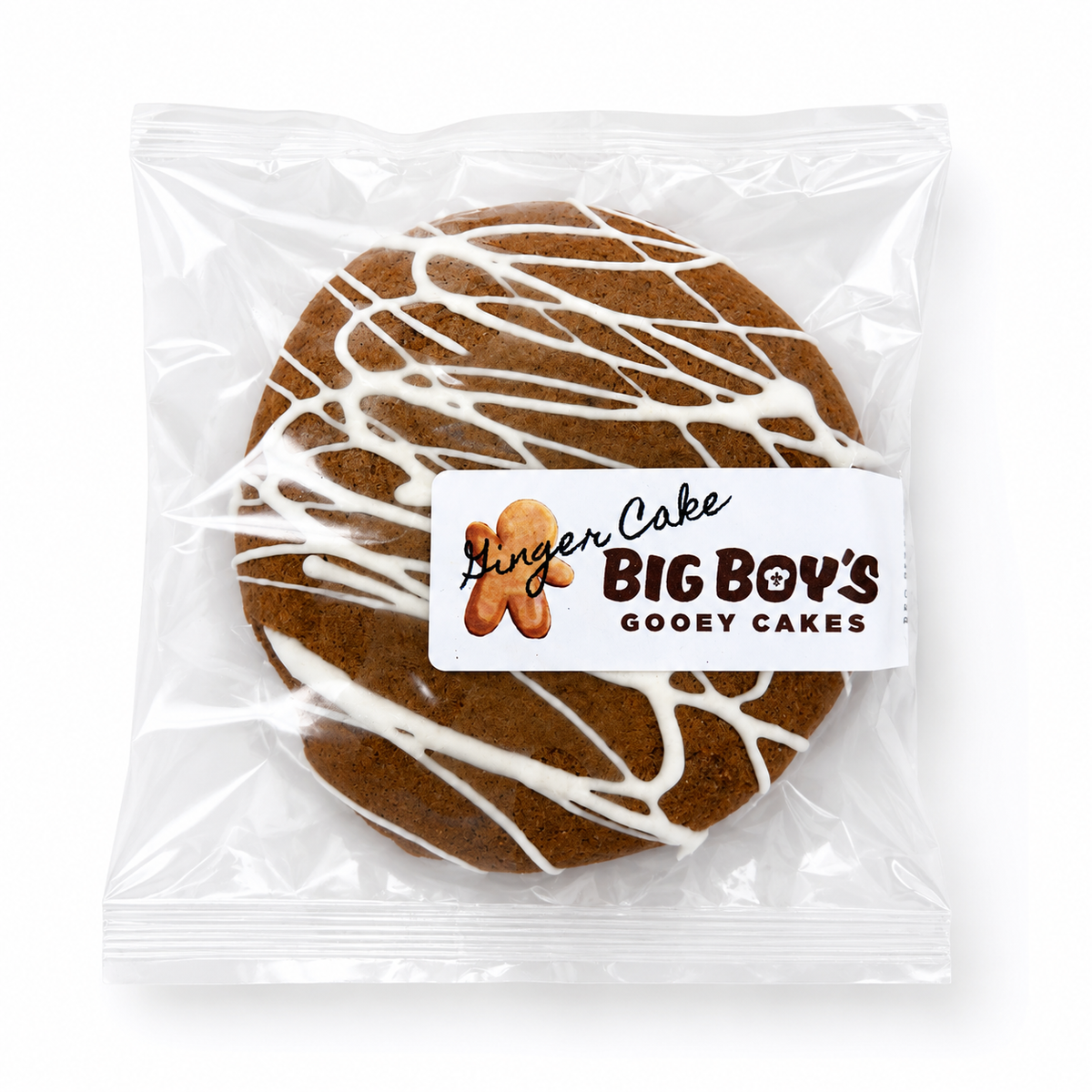 Gingerbread cake with white icing drizzle in clear packaging, featuring 'Big Boy's Gooey Cakes' label.